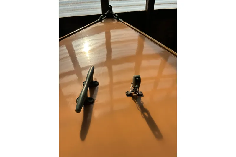 Slide: The Image of Close-up of 1982 Herreshoff 12.5 footer deck with cleat and fitting. - 5