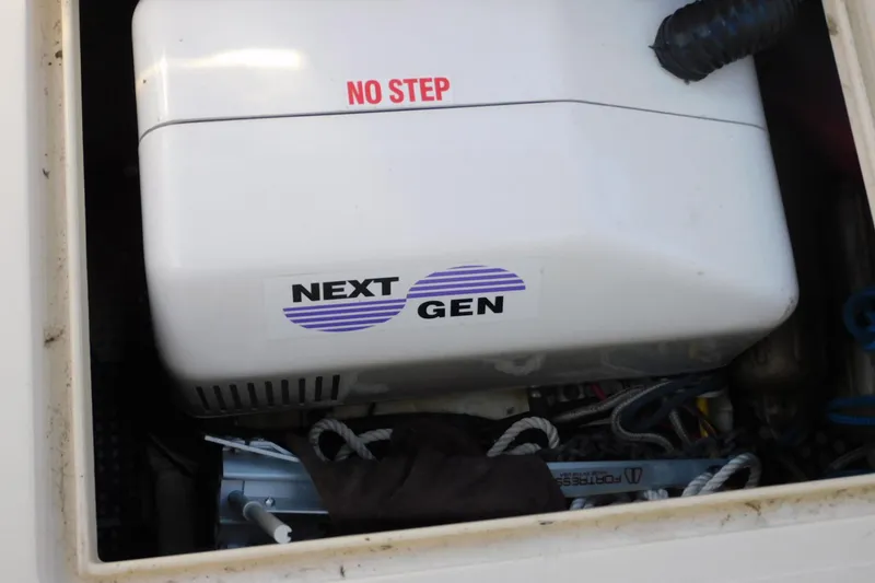 Slide: The Image of Engine compartment of a 2000 Camano Troll boat with "Next Gen" generator. - 31