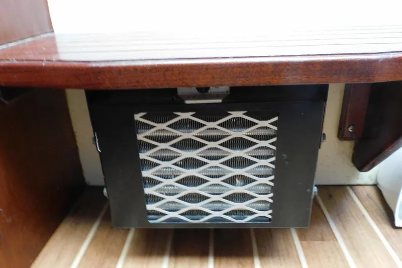 Slide: The Image of 2000 Camano Troll interior heater with wooden paneling and vented design. - 34