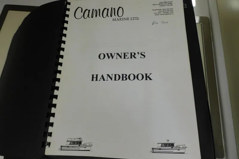 Slide: The Image of Owner's handbook for 2000 Camano Troll boat, featuring cover design with boat illustrations. - 35