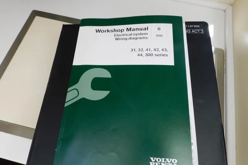 Slide: The Image of Workshop manual for electrical system wiring diagrams, Volvo Penta, on a desk. - 41