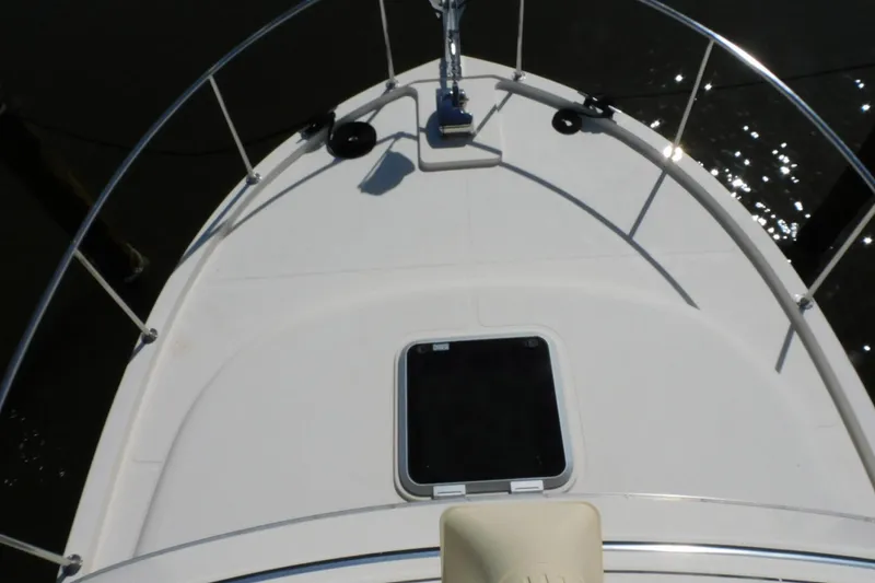 Slide: The Image of Bow view of a 2000 Camano Troll boat with railing and hatch. - 6