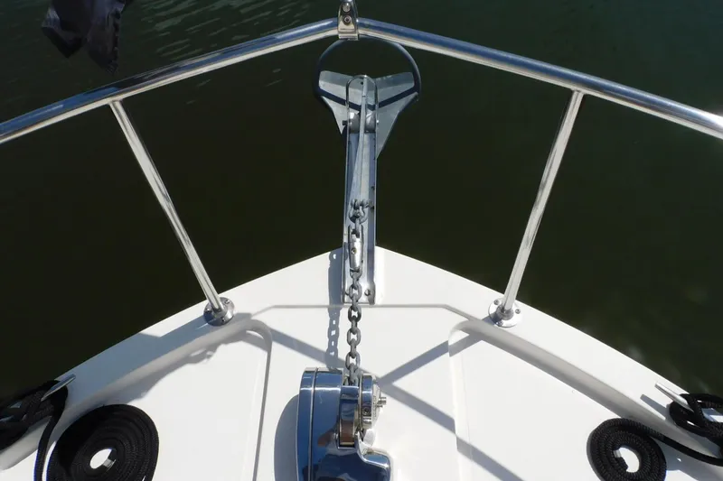 Slide: The Image of Bow view of 2000 Camano Troll boat with anchor and railing. - 9