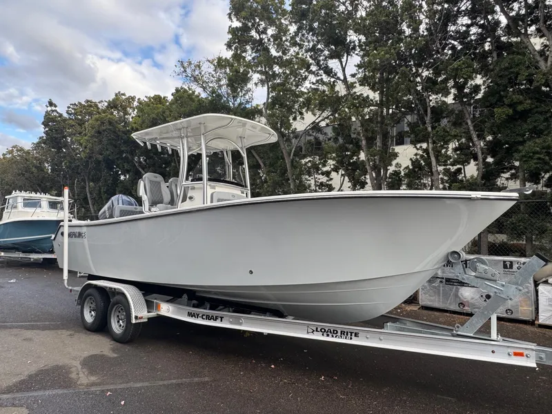 Slide: The Image of 2025 Defiance Catalina 240 boat on trailer, parked outdoors. - 1