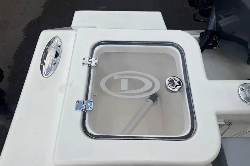 Slide: The Image of 2025 Defiance Catalina 240 boat compartment with transparent lid and logo. - 10
