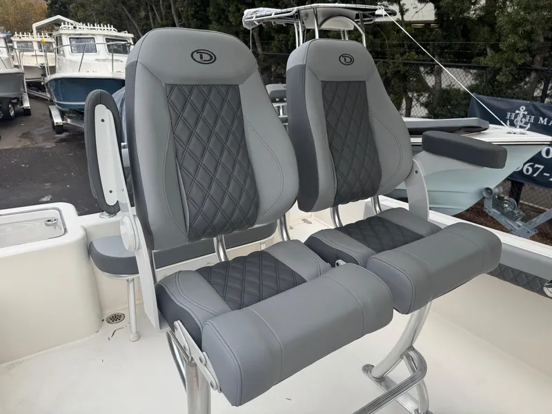 Slide: The Image of Defiance Catalina 240 boat seats, 2025 model, featuring gray and black diamond-pattern upholstery. - 19
