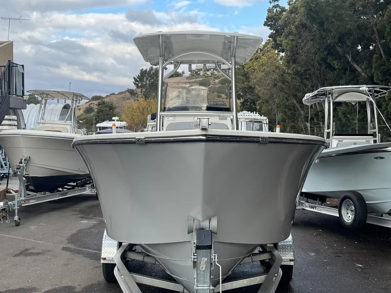 Slide: The Image of 2025 Defiance Catalina 240 boat on trailer, parked outdoors. - 2
