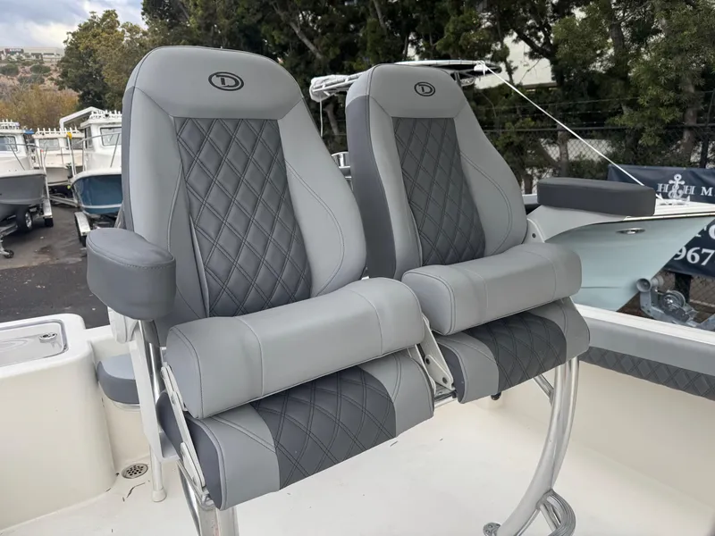 Slide: The Image of Luxury seating on 2025 Defiance Catalina 240 boat, featuring diamond-stitched upholstery. - 20