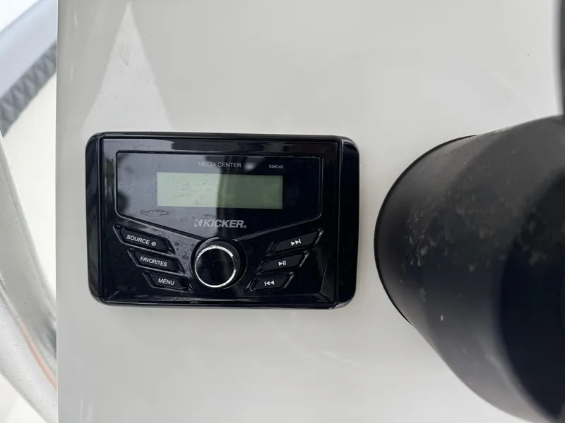 Slide: The Image of Kicker media center on 2025 Defiance Catalina 240 boat dashboard. - 24