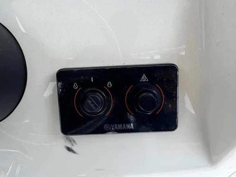 Slide: The Image of Yamaha control panel on 2025 Defiance Catalina 240 boat dashboard. - 25