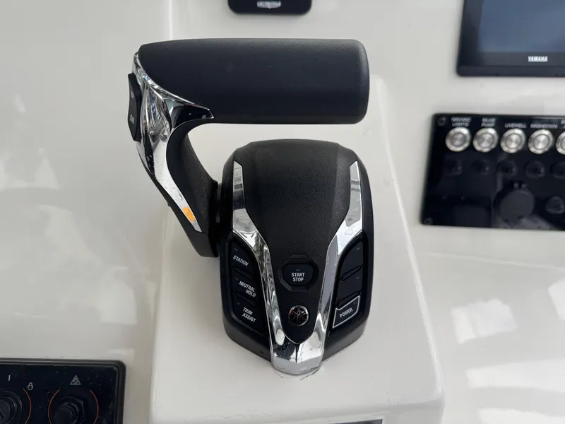 Slide: The Image of Throttle control of 2025 Defiance Catalina 240 boat, featuring modern design and controls. - 26