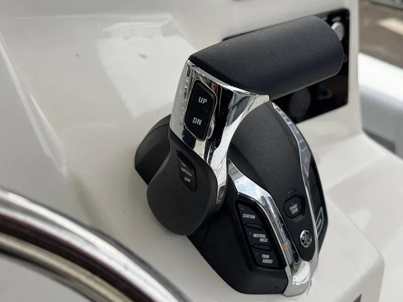 Slide: The Image of Throttle control of 2025 Defiance Catalina 240 boat, featuring ergonomic design and control buttons. - 27