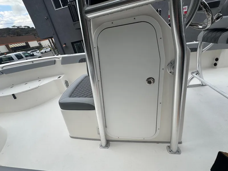 Slide: The Image of 2025 Defiance Catalina 240 boat interior with seating and storage compartment. - 30