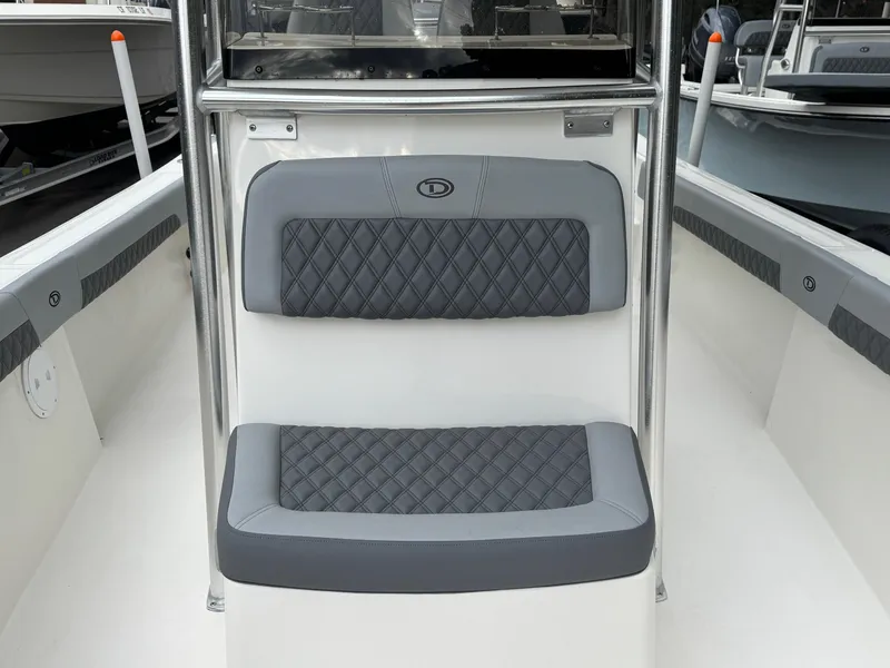 Slide: The Image of 2025 Defiance Catalina 240 boat seating with quilted gray upholstery. - 32