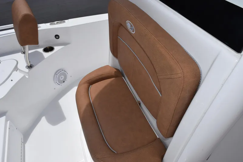 Slide: The Image of 2024 Sea Hunt BX 25 FS boat with brown cushioned seating and white interior. - 13
