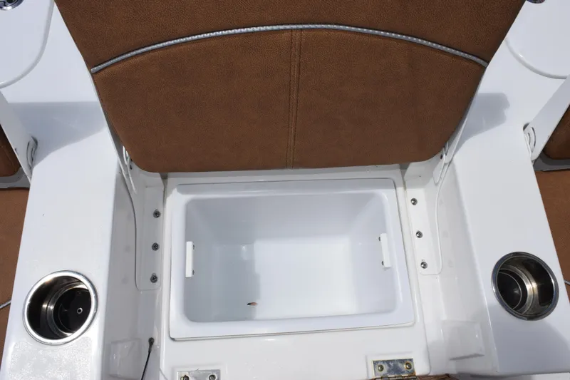 Slide: The Image of 2024 Sea Hunt BX 25 FS boat seat with integrated storage compartment and cup holders. - 16