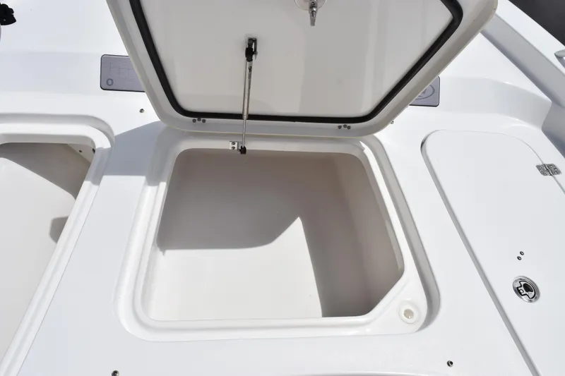 Slide: The Image of Open storage compartment on a 2024 Sea Hunt BX 25 FS boat. - 21