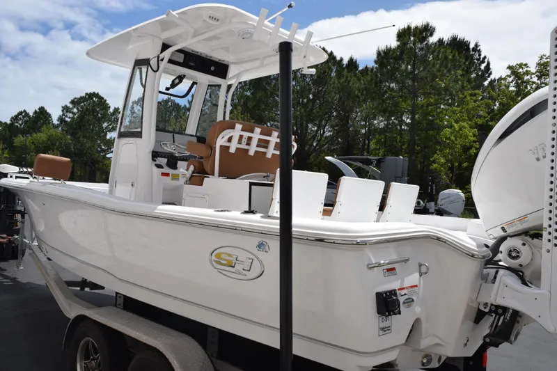Slide: The Image of 2024 Sea Hunt BX 25 FS boat on trailer, featuring sleek design and modern amenities. - 6