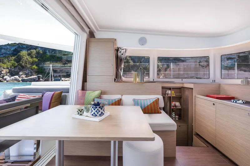 Slide: The Image of Modern interior of 2025 Lagoon 38 catamaran with scenic ocean view. - 27