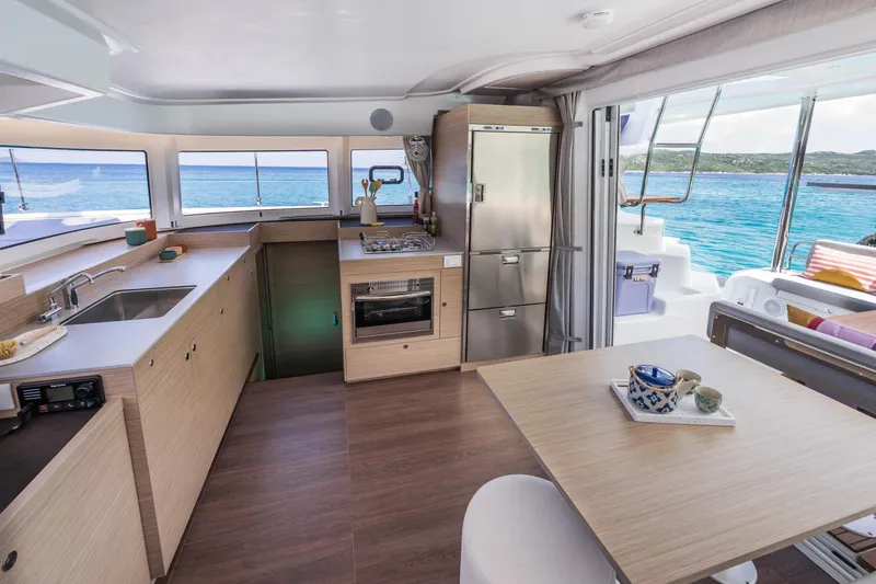 Slide: The Image of Modern kitchen interior of 2025 Lagoon 38 yacht with ocean view. - 28