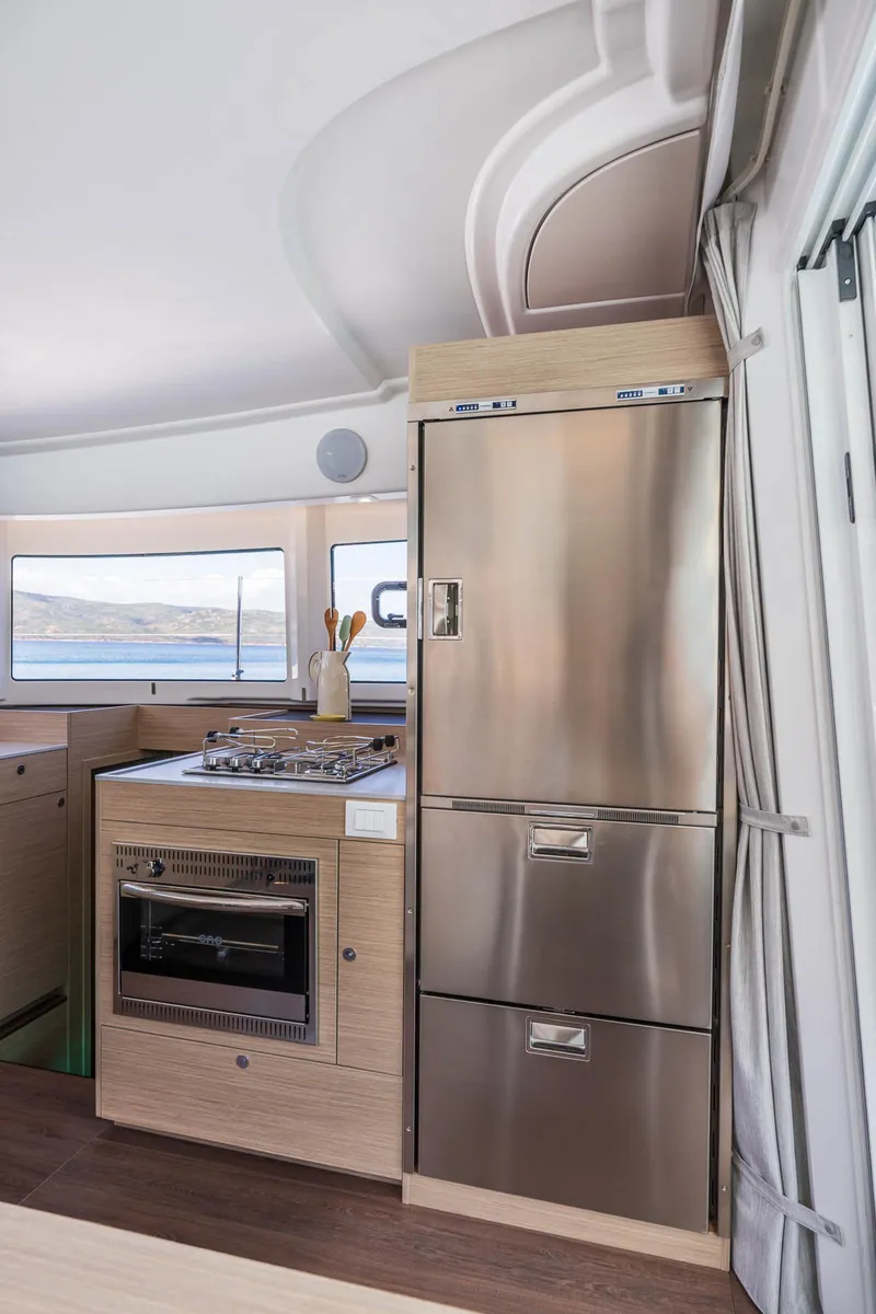 Slide: The Image of Modern kitchen interior of 2025 Lagoon 38 yacht with stainless steel appliances. - 29