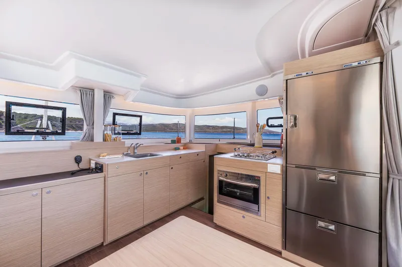 Slide: The Image of Modern kitchen interior of 2025 Lagoon 38 yacht with ocean view. - 30