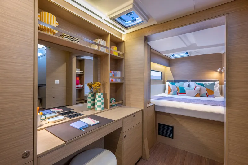 Slide: The Image of Luxurious interior of 2025 Lagoon 38 yacht with modern decor and cozy bedroom. - 38