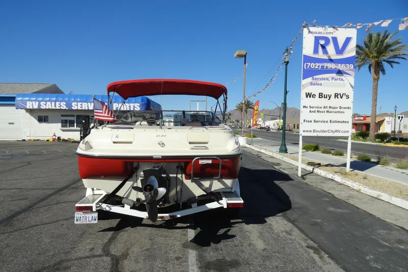 Slide: The Image of 2000 Glastron GX 205 boat on trailer at RV sales lot, Boulder City. - 17