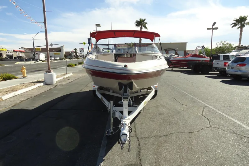 Slide: The Image of 2000 Glastron GX 205 boat on trailer in parking lot, sunny day. - 3