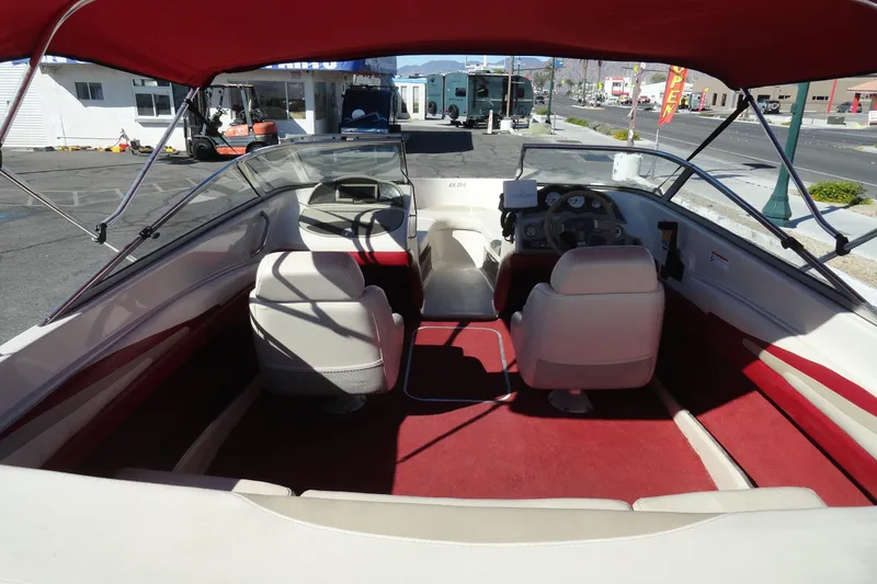 Slide: The Image of Interior of 2000 Glastron GX 205 boat with red and white seating. - 6