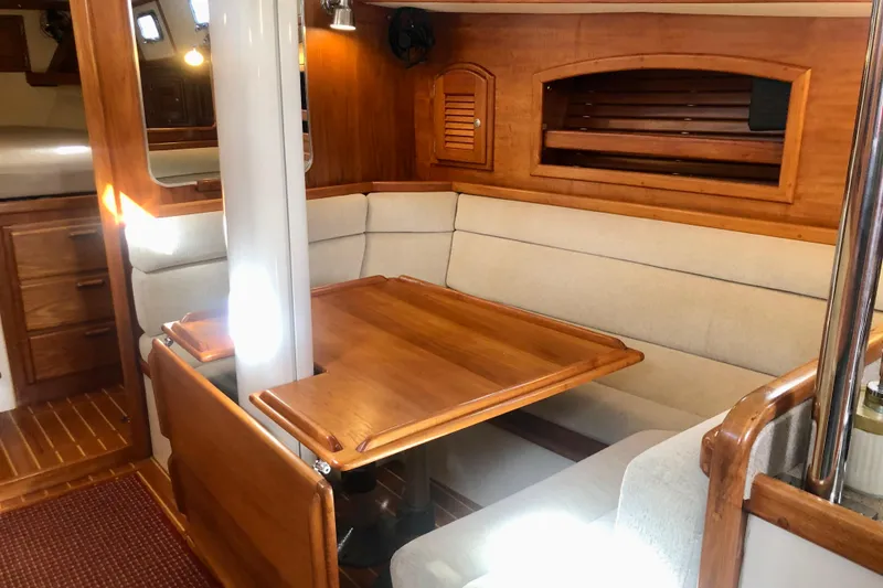 Slide: The Image of Pacific Seacraft 40 main salon settee and table - 12