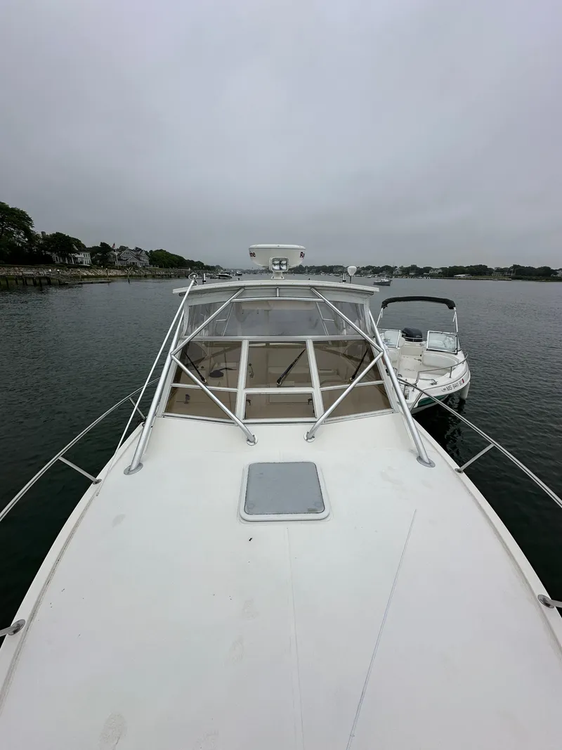 Slide: The Image of 2006 Carolina Classic 28FT boat on calm water. - 12