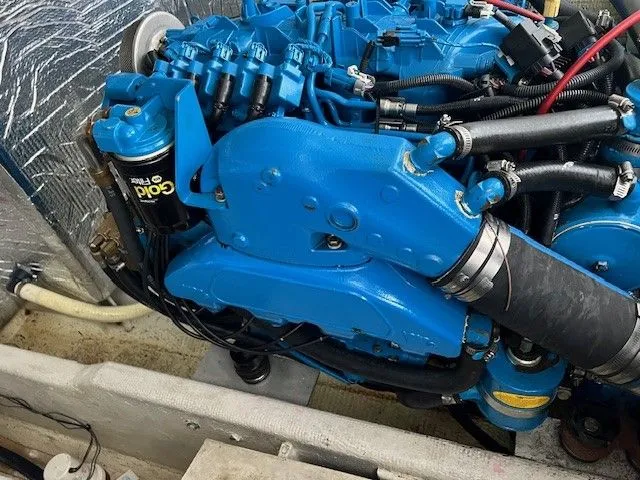 Slide: The Image of Engine of a 2006 Carolina Classic 28FT boat, painted blue. - 16