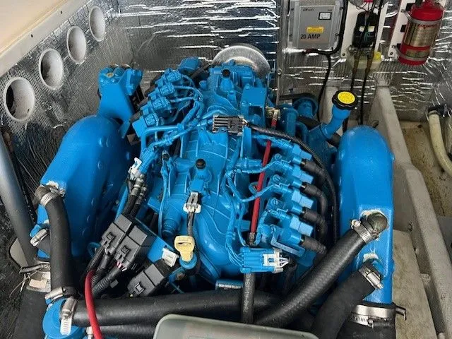 Slide: The Image of Engine compartment of a 2006 Carolina Classic 28FT boat, blue engine. - 17
