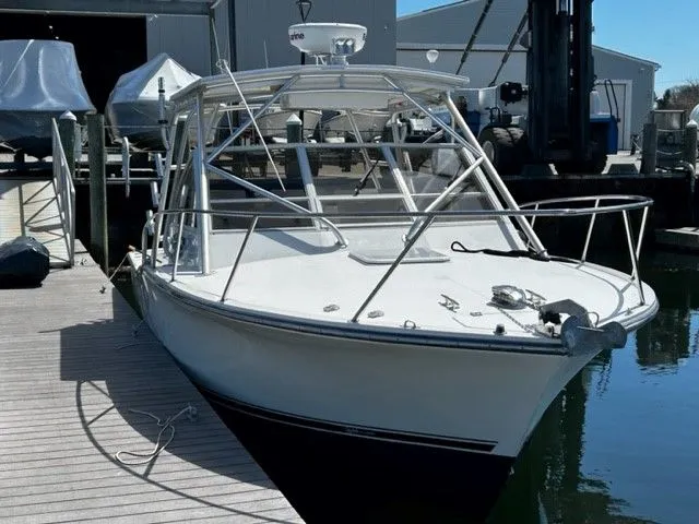 Slide: The Image of 2006 Carolina Classic 28FT boat docked, ready for sailing. - 19