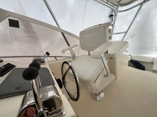 Slide: The Image of Helm station of a 2006 Carolina Classic 28FT boat. - 22
