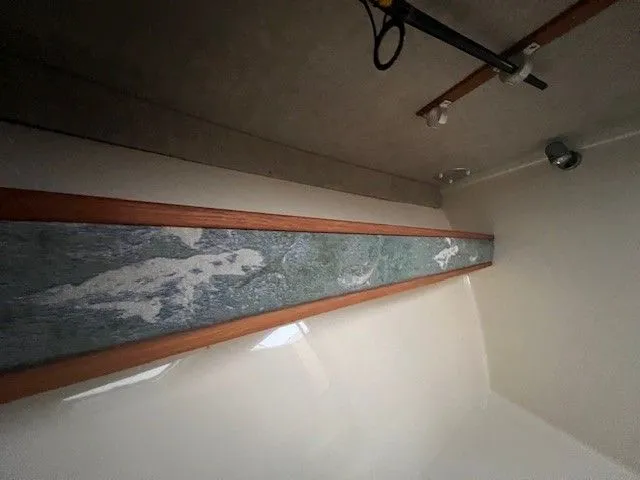 Slide: The Image of Interior of a 2006 Carolina Classic 28FT boat with wood trim. - 25