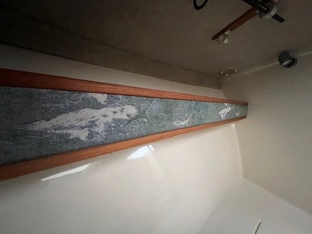 Slide: The Image of Interior of a 2006 Carolina Classic 28FT boat with decorative wood element. - 27