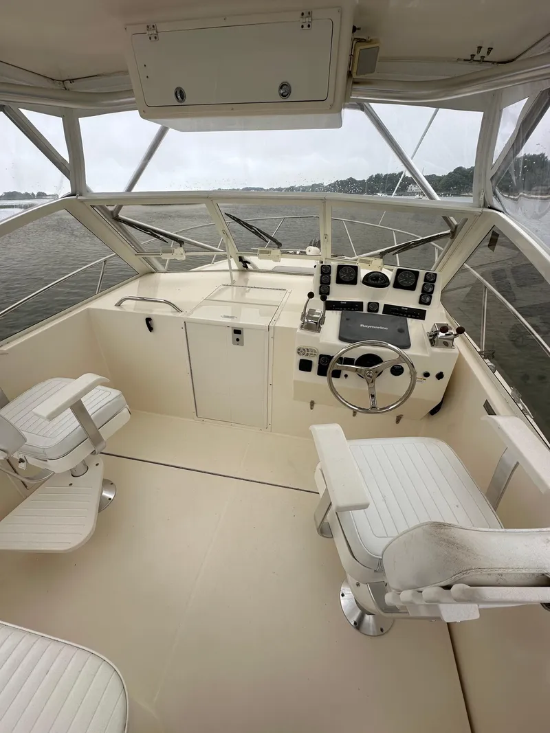 Slide: The Image of Interior of a 2006 Carolina Classic 28FT boat with helm station. - 3