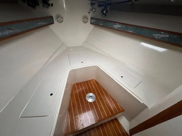 Slide: The Image of Interior of a 2006 Carolina Classic 28FT boat with wooden flooring. - 31