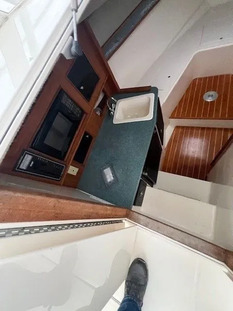 Slide: The Image of Interior of a 2006 Carolina Classic 28FT with kitchenette and sink. - 35