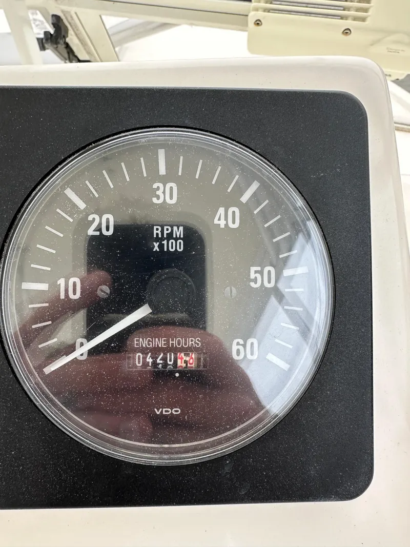 Slide: The Image of Tachometer of a 2006 Carolina Classic 28FT boat, showing 4204.7 engine hours. - 6