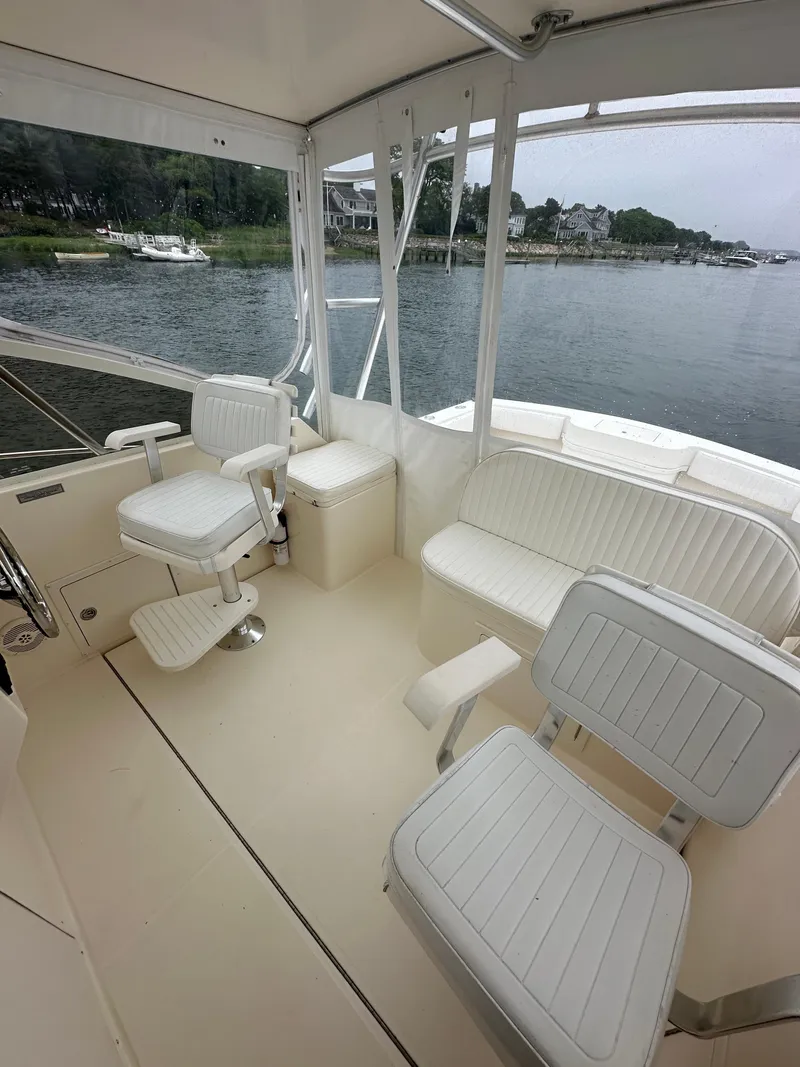 Slide: The Image of Interior of a 2006 Carolina Classic 28FT boat by the water. - 7