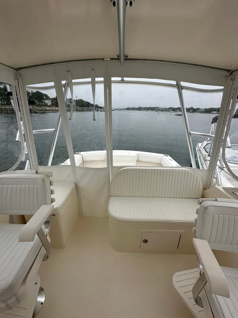 Slide: The Image of Interior view of a 2006 Carolina Classic 28FT boat on calm waters. - 8