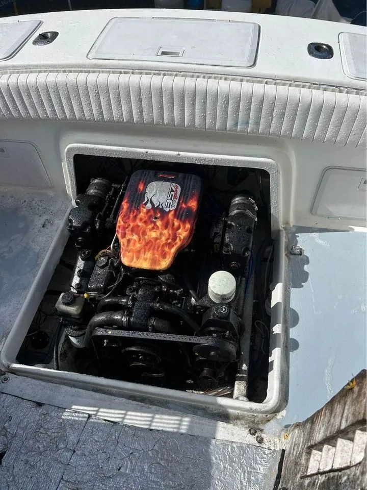 Slide: The Image of 1996 Silverhawk 24cc boat engine with flame design. - 3