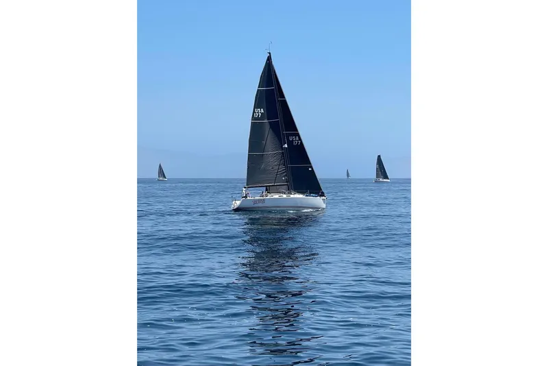 Slide: The Image of Sailing yacht J Boats J/109 (2004) on calm blue waters under clear sky. - 10