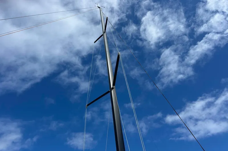 Slide: The Image of Mast spray painted with satin black two part Awlgrip paint. All ss rod standing rigging build recently by Seatec.  - 14