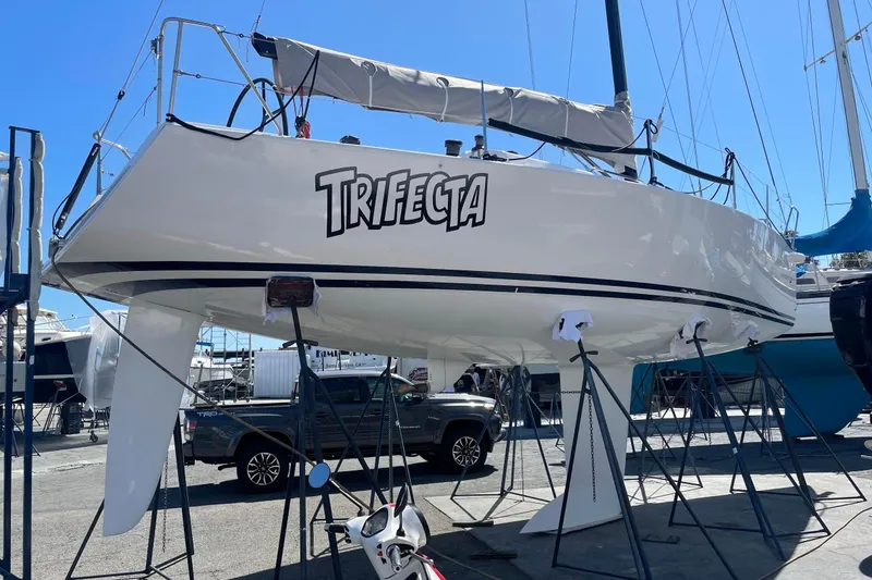 Slide: The Image of Maybe  the best prepared J/109 bottom on the race course. Keel  and rudder foil design  modified by Greg Stewart from Nelson Merek Yacht Design.  Keel and rudder faired to templates. Work completed by Dennis Choate at his speed shop. - 2