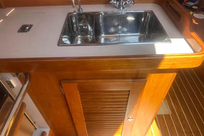 Slide: The Image of 2004 J Boats J/109 yacht interior with kitchen sink and stove. - 32