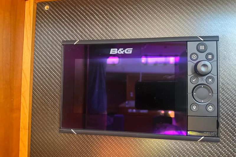 Slide: The Image of B&G navigation system display for wind, plotter, speed and depth  mounted on carbon fiber panel. - 48